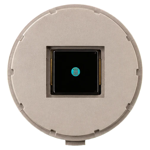 PPG sensor puck: a circular metal housing with a black optical sensor die at its centre.